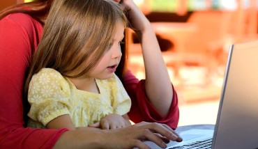 a child in front of a laptop